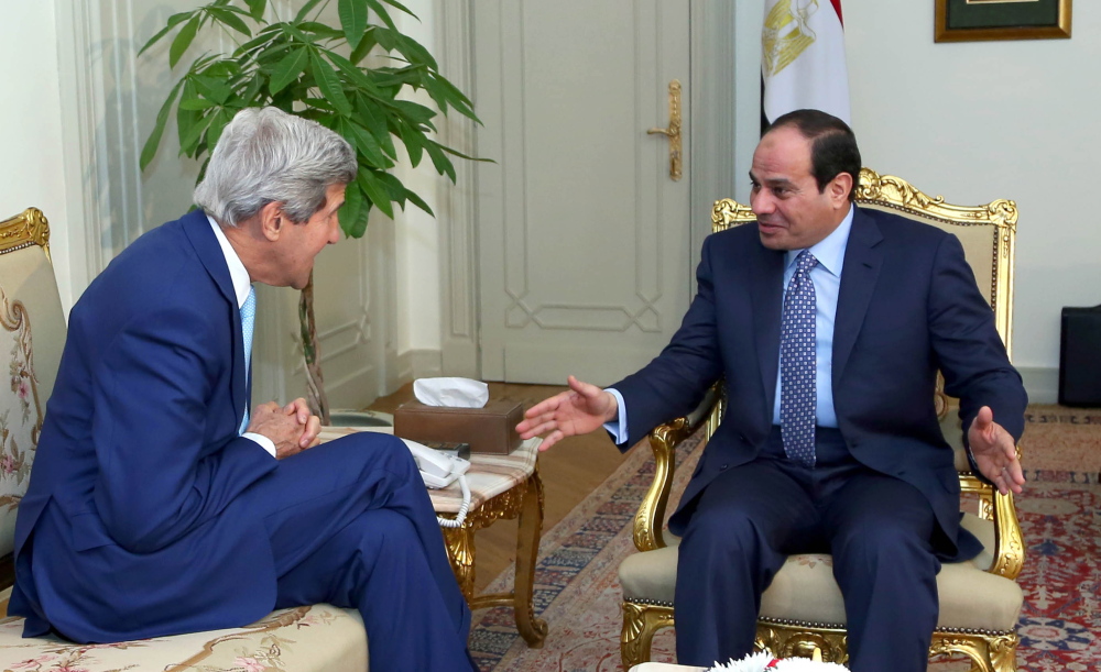U.S. Secretary of State John Kerry, left, talks with Egypt’s President Abdel-Fattah el-Sissi at the presidential palace in Cairo, Egypt, on Sunday.