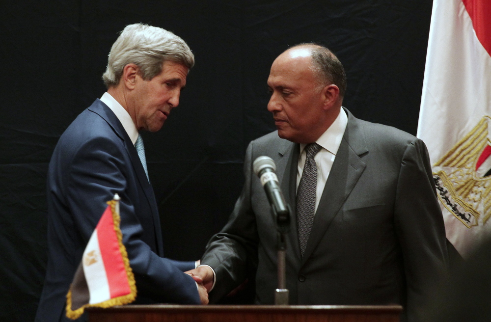 U.S. Secretary of State John Kerry, left, shakes hands with Egyptian Foreign Minister Sameh Shoukry following a joint news conference on Sunday in Cairo, Egypt. Shoukry welcomed Kerry’s visit as important for ties between the two governments. “I hope we will have a fruitful discussion here,” he said. 