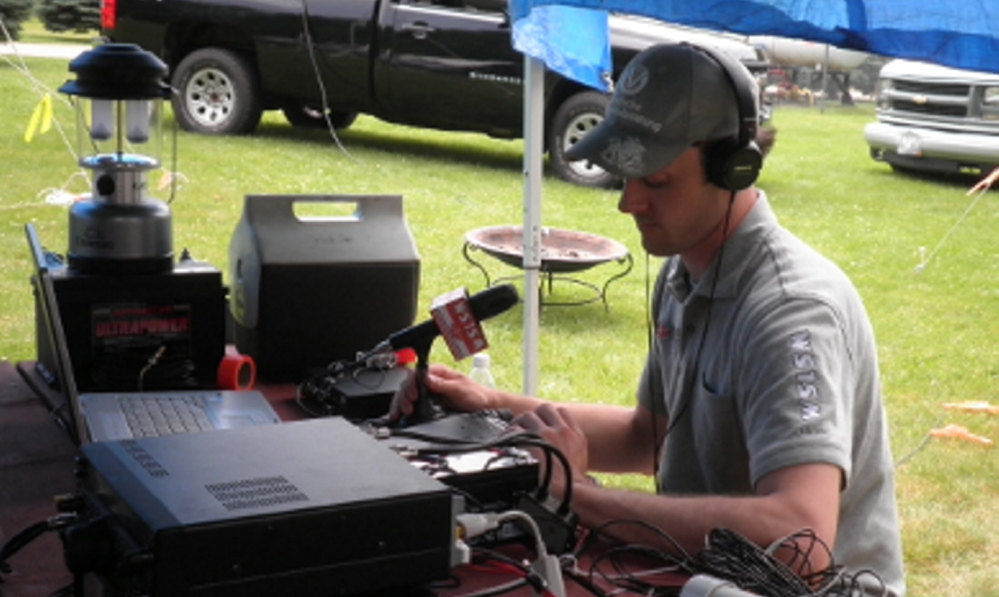 Tim Watson, a member of the Wireless Society of Southern Maine amateur radio club, mans the communication center during the 2013 Field Day event at Wassamki Springs Campground in Scarborough. This year’s event will begin at 2 p.m. Saturday at the same locale.