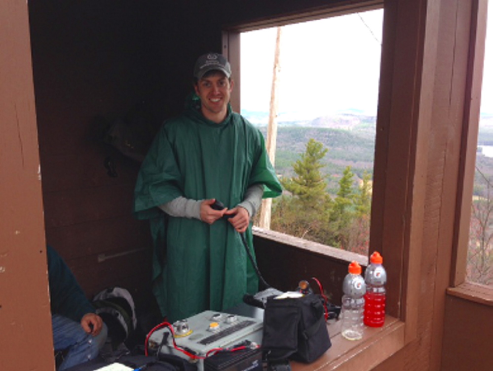 Ham Radio operator Tim Watson sets up a communication station during a summit event, where team members attempt to set distance records for making radio contacts. Photo courtesy Tim Watson.