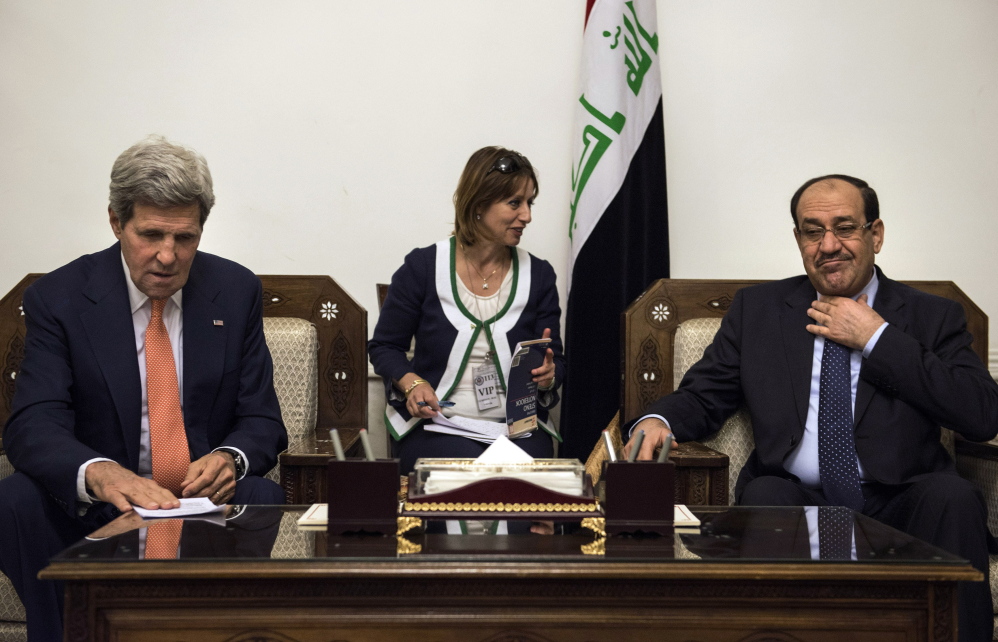 U.S. Secretary of State John Kerry meets with Iraqi Prime Minister Nouri al-Maliki at the prime minister’s office in Baghdad on Monday. Iraqi officials briefed on the talks said al-Maliki urged the United States to target the militants’ training camps and convoys  in Iraq and neighboring Syria with airstrikes.
