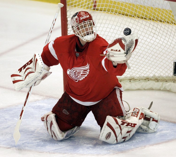 The Associated Press
In this April 3, 2008 file photo, Detroit Red Wings goalie Dominik Hasek, of the Czech Republic, stops a Columbus Blue Jackets’ Rick Nash shot in the first period of an NHL hockey game in Detroit.