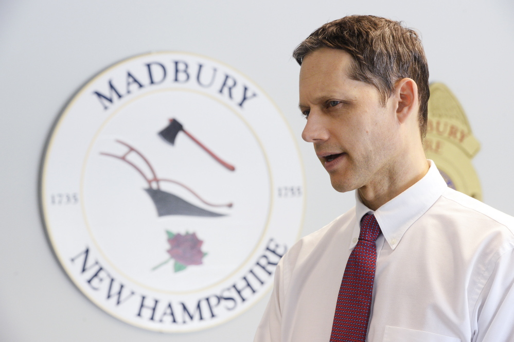 New Hampshire Assistant Attorney General Jeffery Strelzin, chief of the homicide unit, talks with a reporter at the Madbury, New Hampshire, Police Department on Monday.