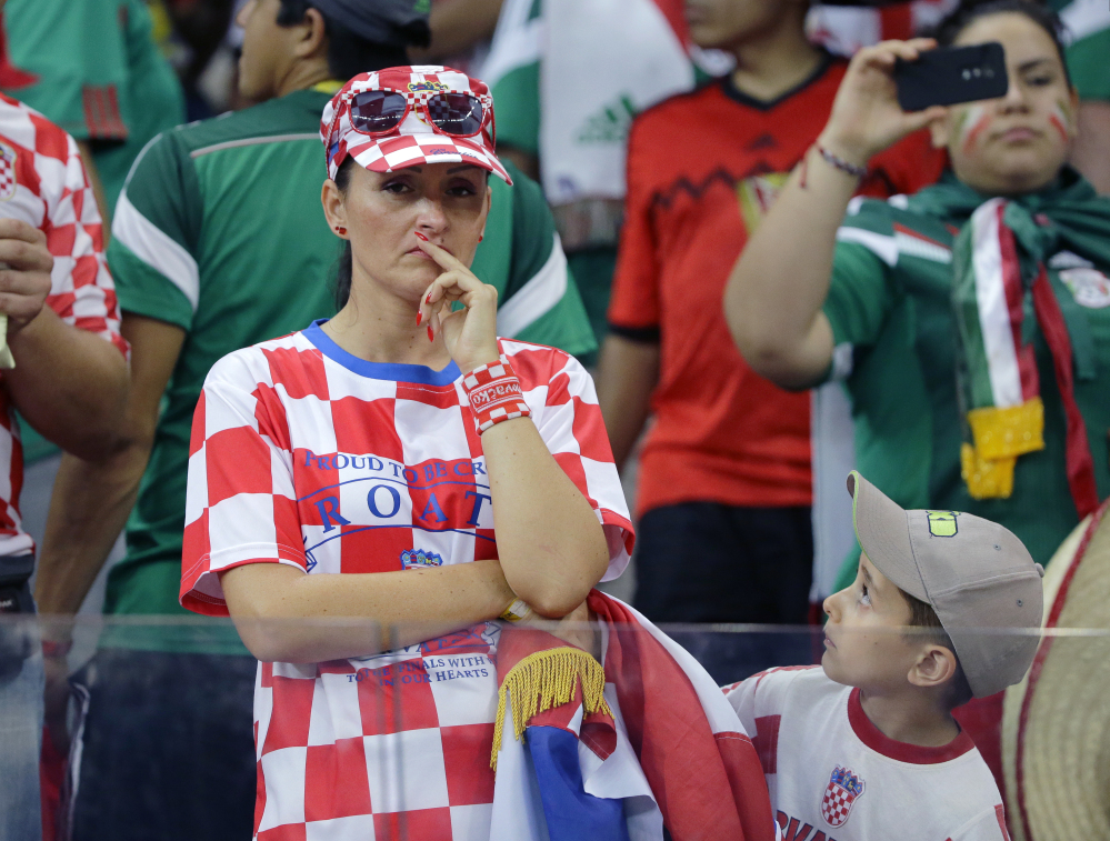 A Croatian fan reacts after the group A World Cup soccer match between Croatia and Mexico. Mexico won the match 3-1.