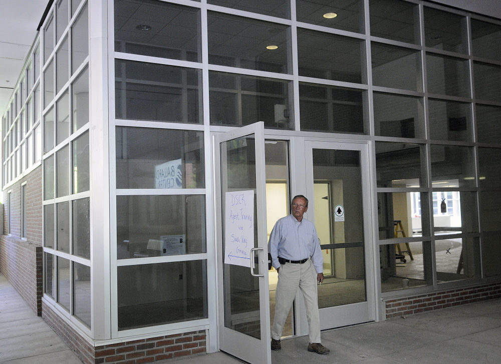 Bill Dowling of Mattson Development exits through the atrium entrance of the former MaineGeneral hospital building in Augusta on Monday.
