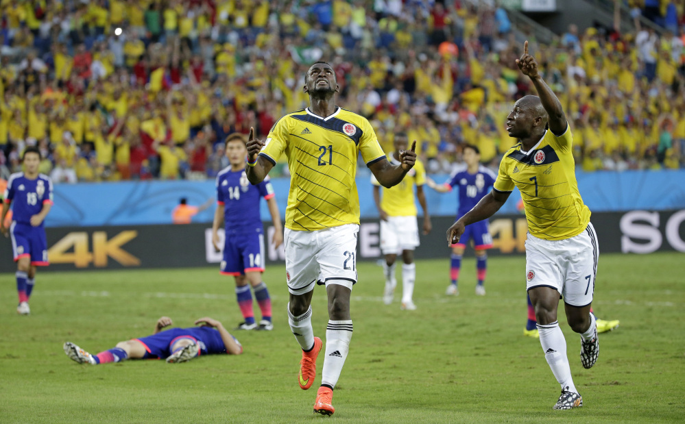 Colombia’s Jackson Martinez celebrates after scoring his side’s second goal during the group C World Cup soccer match between Japan and Colombia.