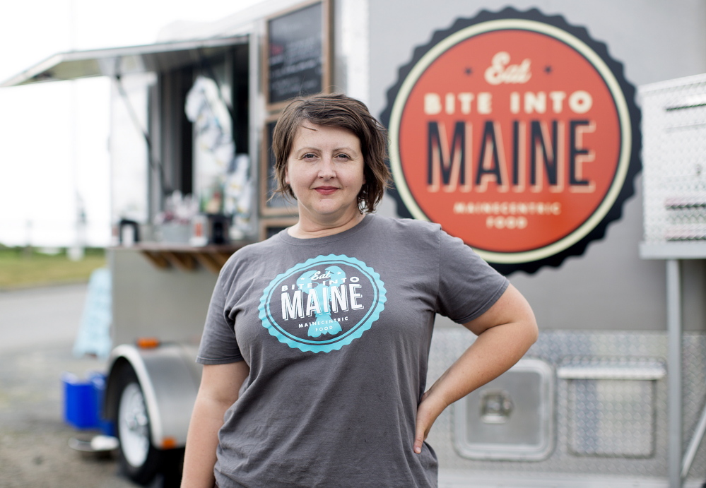 Sarah Sutton takes a break from selling lobster rolls from her Bite Into Maine food truck at Fort Williams Park on Wednesday. “We have the best office view ever!” she said.