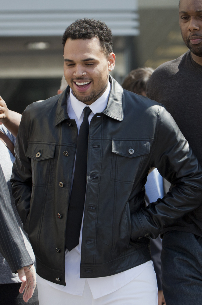 Singer Chris Brown leaves Superior Court in Washington on Wednesday. Lawyers failed to reach a plea deal in his assault case.