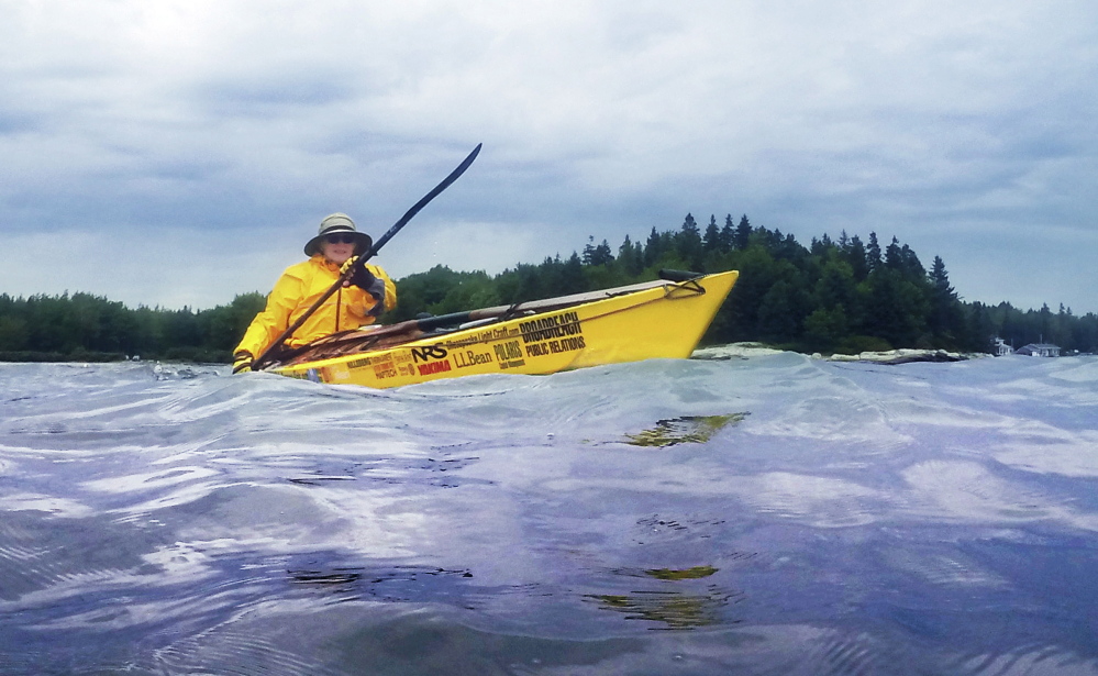 Deb Walters of Troy paddles off Owls Head on Wednesday. She intends to spend a year kayaking 2,500 miles from Maine to Guatemala, while raising money for additional grades in schools set up in Guatemala City by Safe Passage, a Maine-based nonprofit.