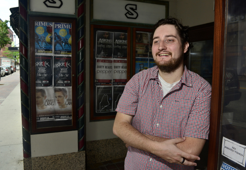Cody DeLong stands in front of the State Theatre in Portland on Wednesday. His company, Sound Rink, is growing as musicians look for ways to diversify their revenue streams. “I could be anywhere, but I choose to be here,” he said.