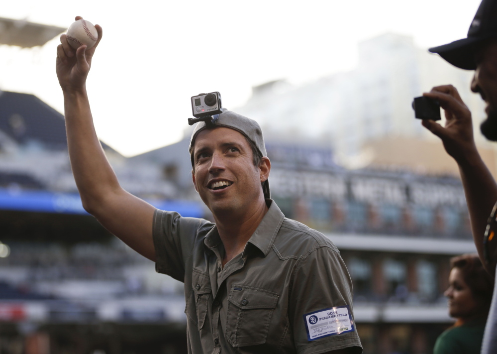 GoPro founder and CEO Nicholas Woodman wears a GoPro camera on his head as he throws the ceremonial first pitch in San Diego. GoPro will begin trading Thursday on the Nasdaq.