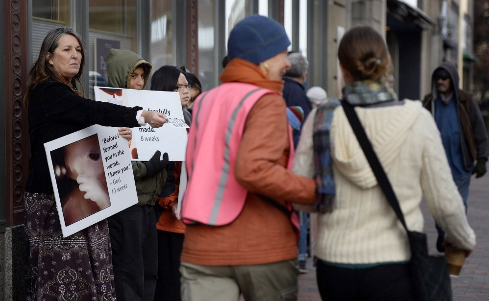An "escalation of crime against Planned Parenthood health centers” nationally has led the organization to stop using volunteers to help patients navigate through anti-abortion protesters into the clinic in downtown Portland, its spokeswoman says.