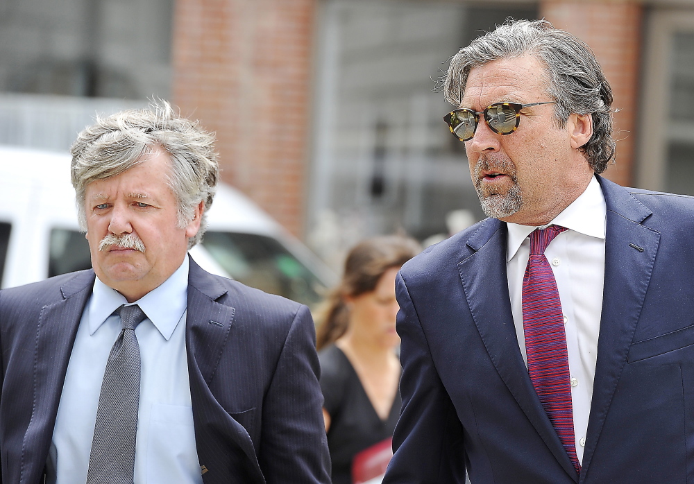 Walter Scott Fox III, 56, left, formerly of Cumberland, walks into the federal courthouse in Portland with attorney Thomas Hallett on Thursday.