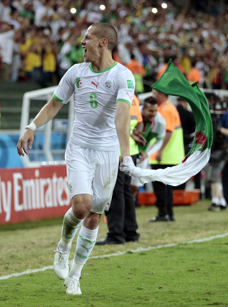 Algeria’s Djamel Mesbah celebrates after the group H World Cup soccer match between Algeria and Russia at the Arena da Baixada in Curitiba, Brazil, on Thursday.