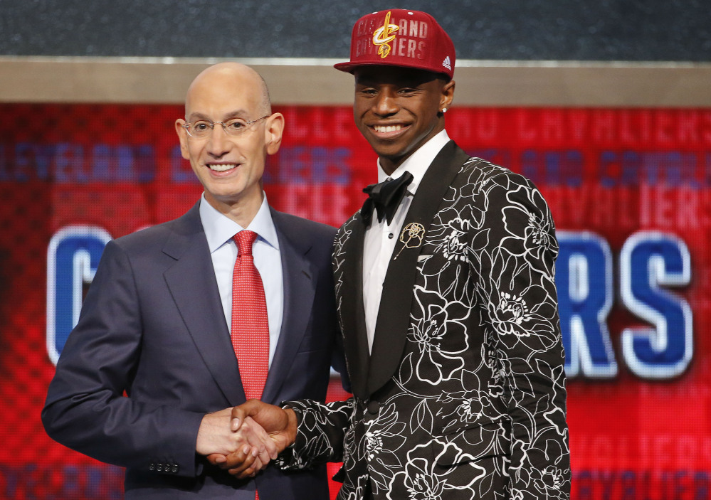NBA Commissioner Adam Silver, left, congratulates Andrew Wiggins of Kansas, who was selected by the Cleveland Cavaliers as the No. 1 pick in the 2014 NBA draft Thursday in New York.