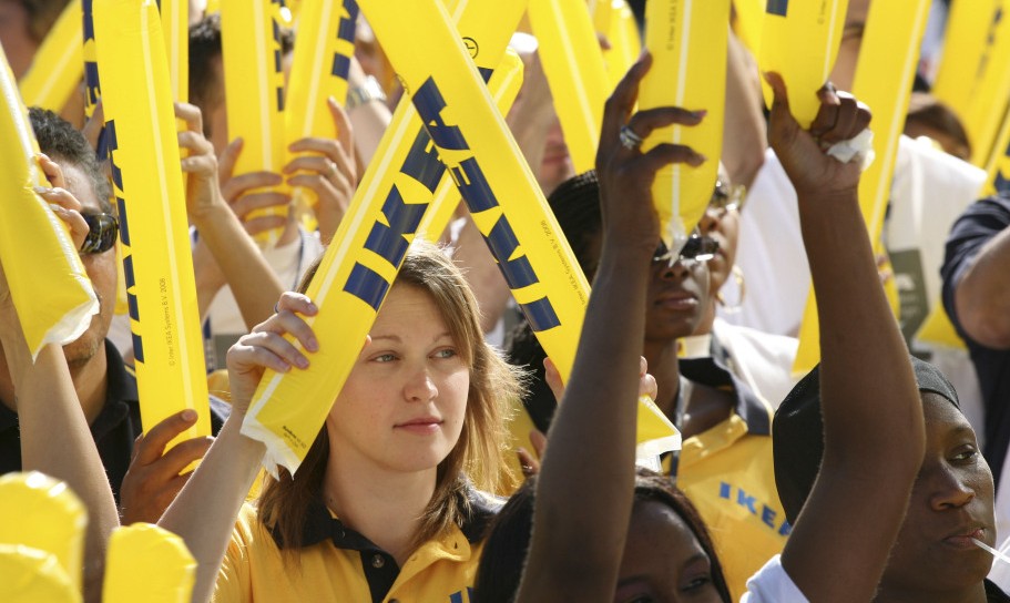 Ikea employees cheer during the grand opening of New York City’s first Ikea store, in Brooklyn, on June 18, 2008.
