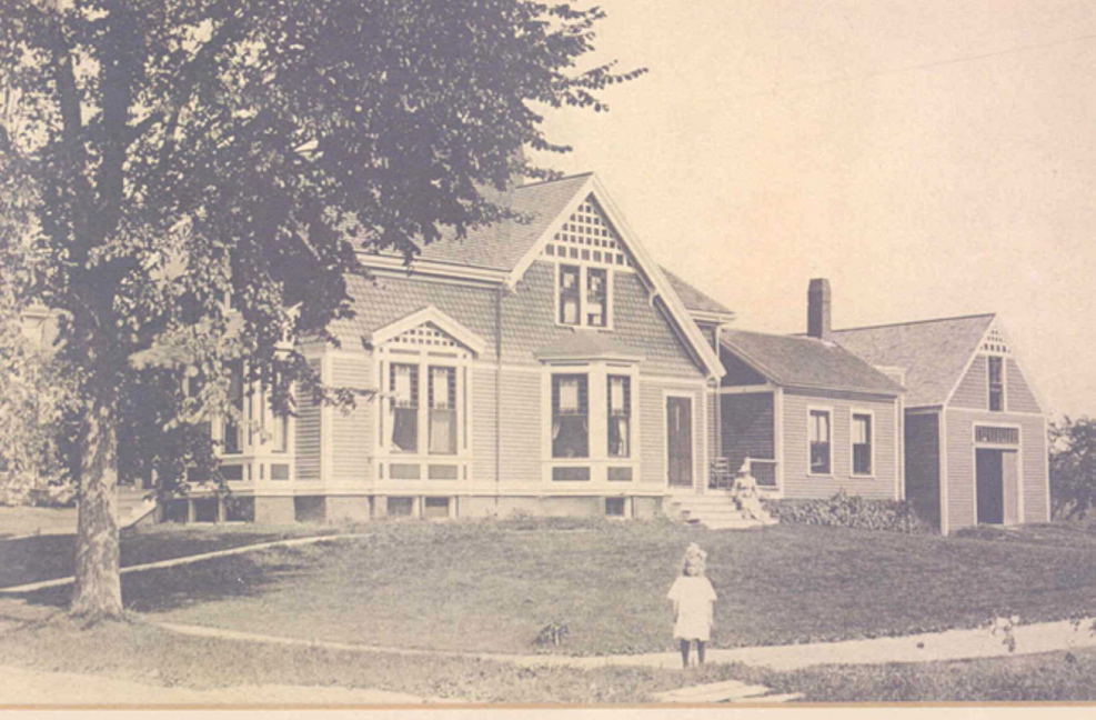 L.L. Bean’s daughter, the late Barbara Bean Gorman, stands in front of the family’s home at 6 Holbrook St. in Freeport in the early 1900s. L.L. Bean started his company and lived most of his life in the Queen Anne-style home.