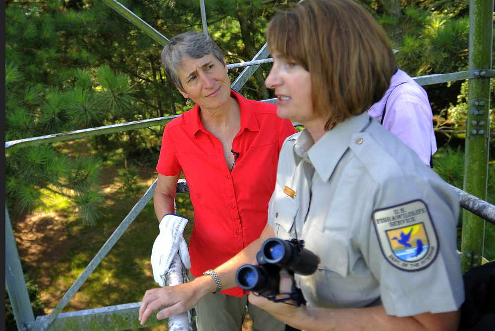 U.S. Interior Secretary Sally Jewell, left, listens to U.S. Fish and Wildlife Service refuge manager Kimberly Hayes during a tour of the Harris Neck National Wildlife Refuge.