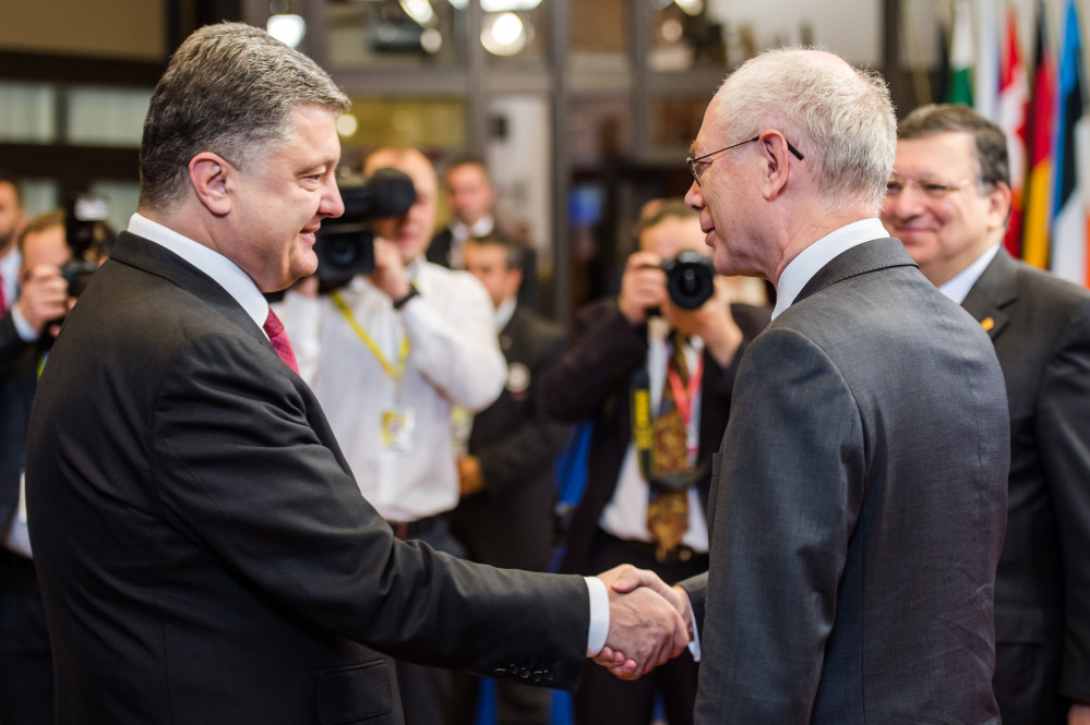 EU Council President Herman Van Rompuy, right, welcomes Ukraine’s President Petro Poroshenko during a summit in Brussels on Friday.