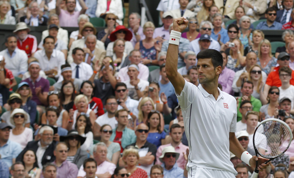 Novak Djokovic of Serbia celebrates winning against Gilles Simon of France during the men’s singles match in Wimbledon, London, Friday, June 27, 2014.