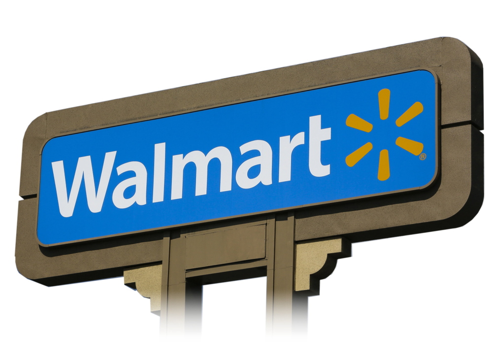 In this May 28, 2013 file photo, an outdoors sign for Walmart is seen in Duarte, Calif. Canada’s Supreme Court ruled Friday that Wal-Mart must compensate former workers at a Quebec store that was closed after they voted to become the first Wal-Mart store in North America to unionize.