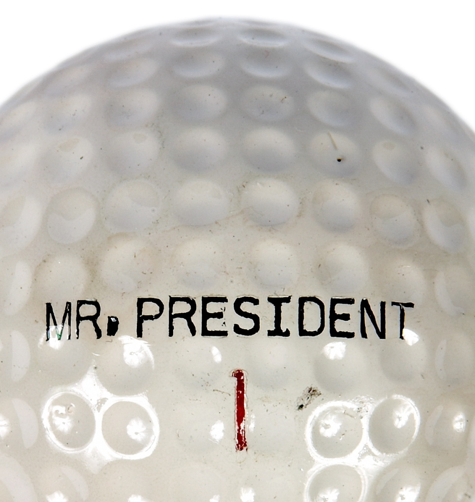 A golf club, golf cart and a set of personalized “Mr. President” golf balls are on display at the museum.