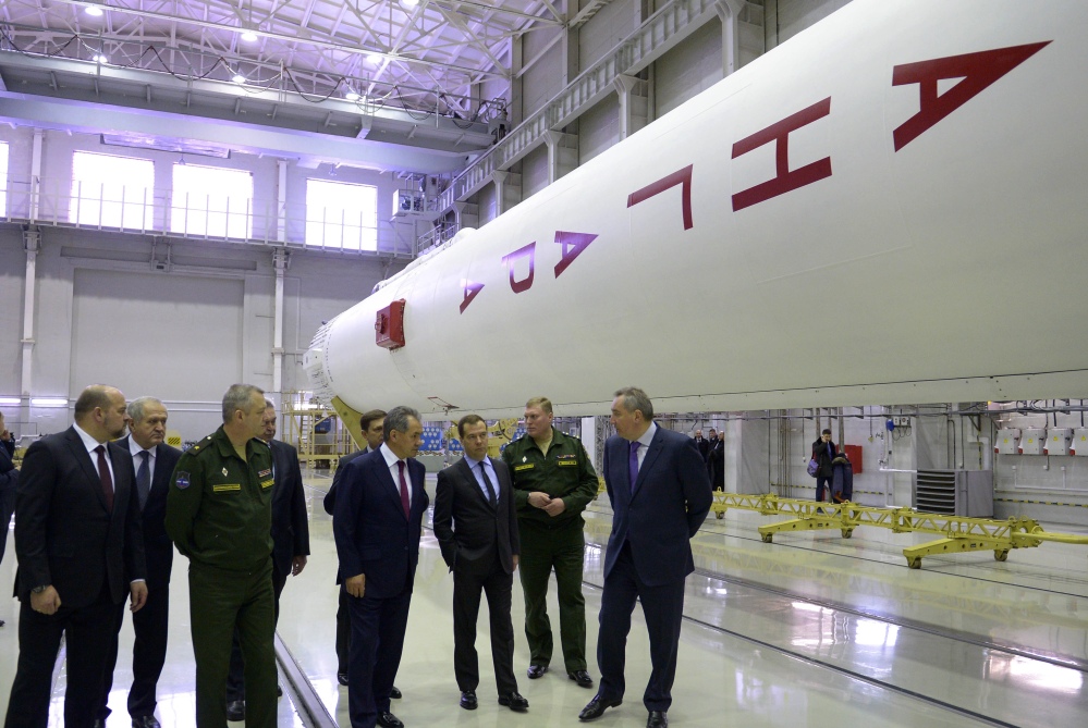 Russian officials visit an assembly shop, with the Angara booster rocket at right, at the Plesetsk Cosmodrome in northwestern Russia in February. Angara’s first launch was aborted Friday by an automatic safety system moments before its blastoff from the Plesetsk launch pad.