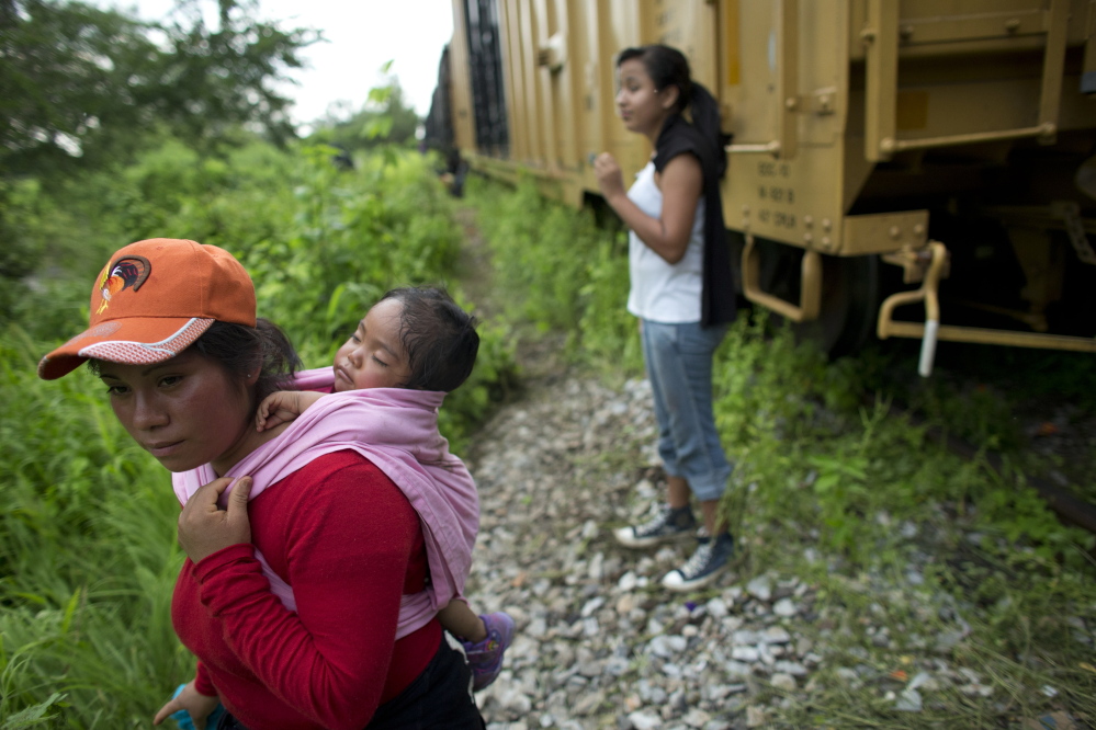 Guatemalan migrant Gladys Chinoy, 14, back right, said she was more excited about seeing her mother in the United States than she was scared about riding a train through Mexico. Her mother said the travel risks were worth taking after spending five years apart.