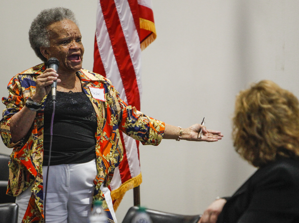 Rachel Jamison, 66, left, of Memphis, addresses her concerns with the VA system at a town hall meeting. The system has a “corrosive culture,” according to a presidential review.