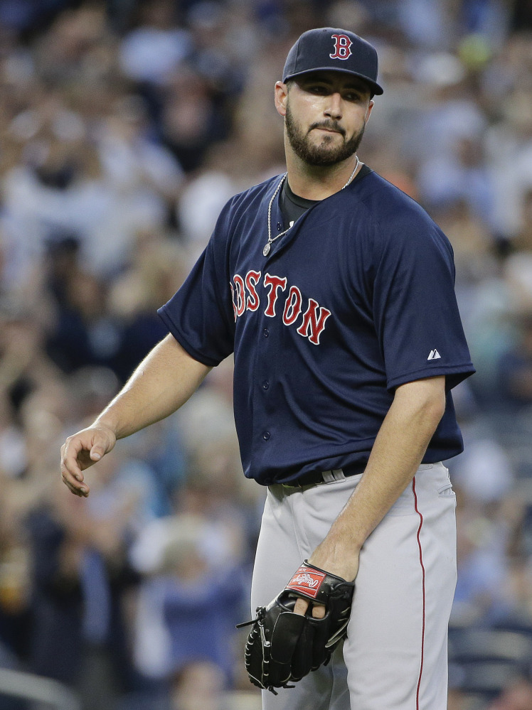 Boston Red Sox pitcher Brandon Workman reacts to New York Yankees’ Brett Gardner’s solo home run to right field.