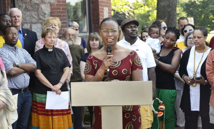 Suavis Furaha, an asylum seeker from Burundi, speaks during a news conference at Deering Oaks in Portland to protest Gov. Paul LePage’s cuts to General Assistance to undocumented immigrants.