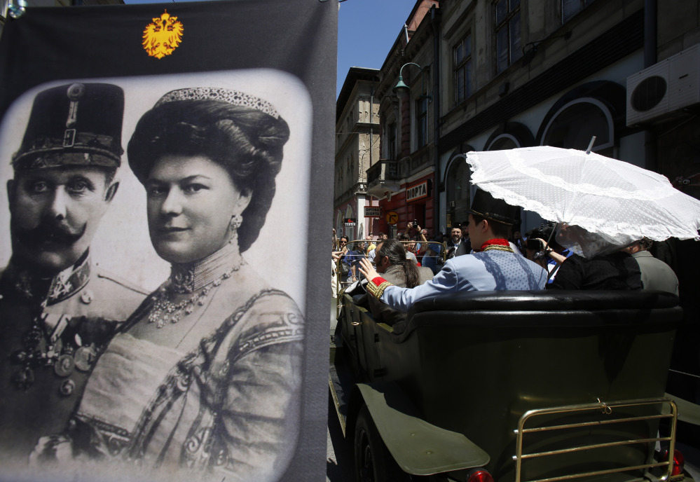 Tourists pose for photos inside a replica of the car where Gavrilo Princip assassinated Austro-Hungarian heir to the throne Archduke Franz Ferdinand, in Sarajevo on Saturday.