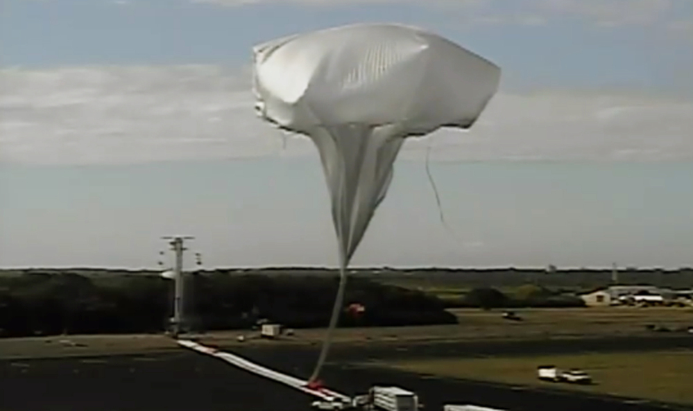 A high-altitude balloon carrying a saucer-shaped vehicle is launched in Kauai, Hawaii, on Saturday to test technology that could be used to land on Mars. Saturday’s experimental flight high in Earth’s atmosphere tested a giant parachute designed to deliver heavier spacecraft and eventually astronauts. Image provided by NASA.