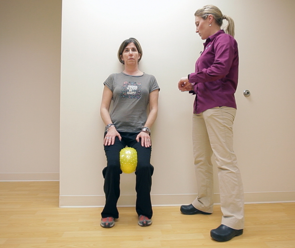 Physical therapist Lydia Cote watches as Meredith Bell performs exercises to build her strength and balance during a physical therapy session at Goodwill NeuroRehab Services in Portland.