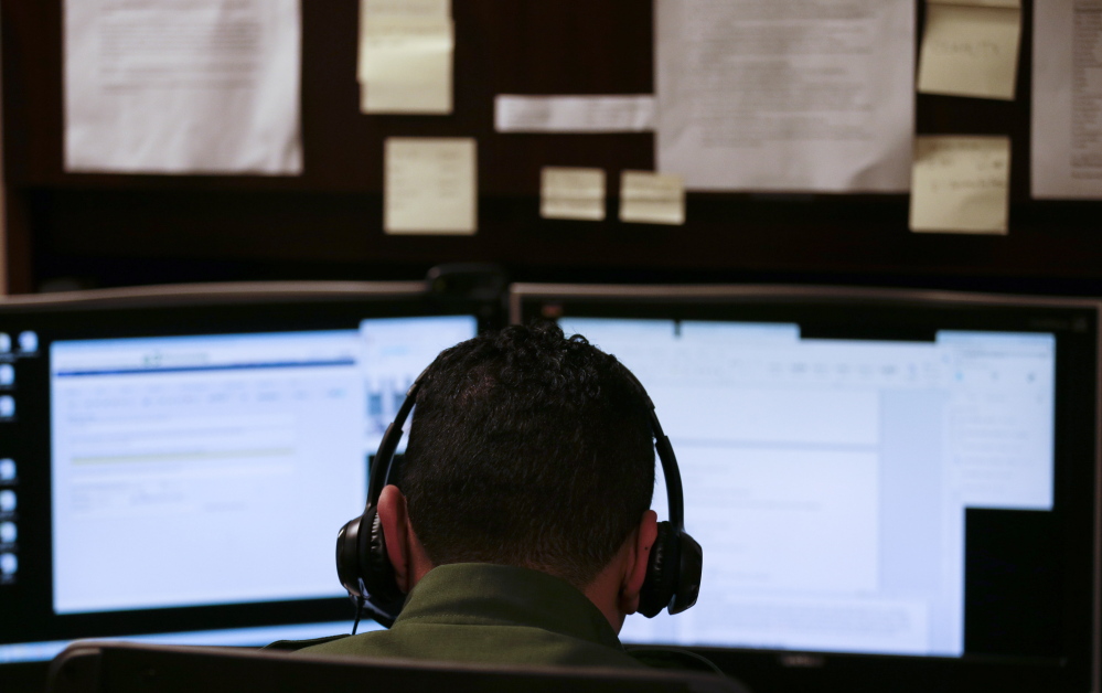 A Border Patrol agent in San Diego uses a headset and computer to conduct a long-distance interview by video with a person arrested crossing the border in Texas. With a dramatic increase of Central Americans crossing in South Texas, the Border Patrol is enlisting agents in less busy sectors to process arrests through video interviews.