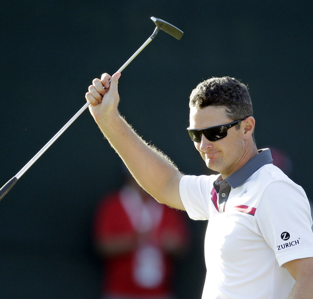 Justin Rose celebrates after he won a playoff Sunday against Shawn Stefani in the Quicken Loans National, earning his first victory since the 2013 U.S. Open.