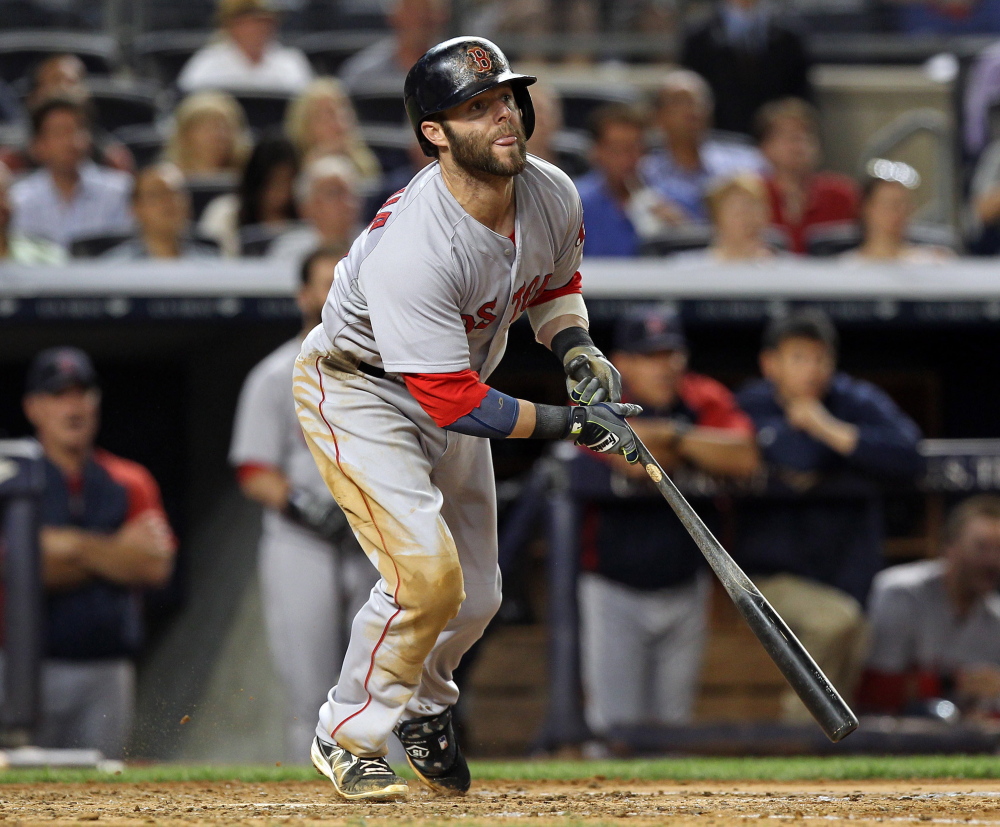 Dustin Pedroia watches his two-run single in the fifth inning Sunday against the New York Yankees. Pedroia went 3 for 3 with three RBI to lead the Red Sox to an 8-5 win.