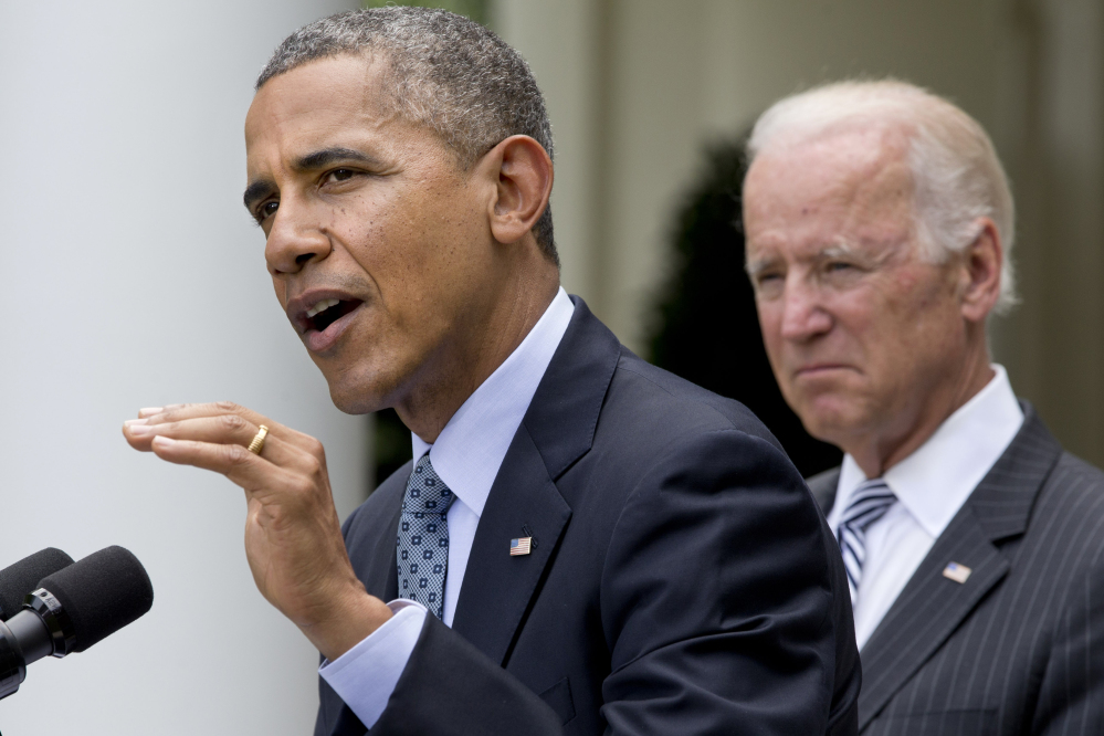President Barack Obama, accompanied by Vice President Joe Biden, makes an announcement about immigration reform Monday in the Rose Garden of the White House in Washington.