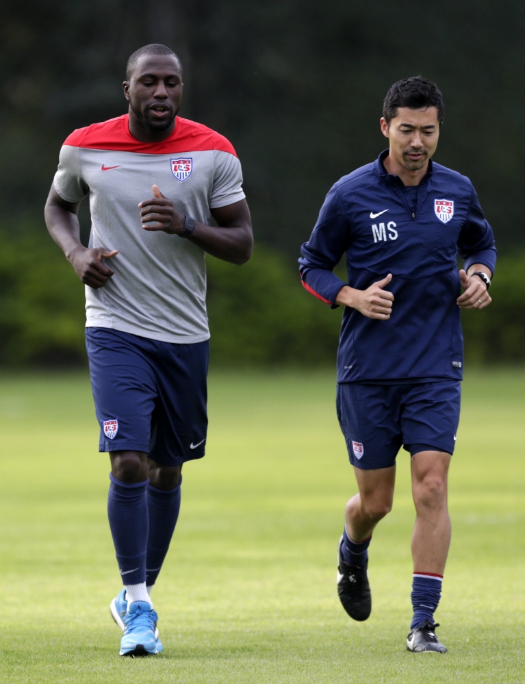 United States’ Jozy Altidore, left, works out with trainer Masa Sakihana during a training session in Sao Paulo, Brazil, Saturday, June 28, 2014. The U.S. will play against Belgium in the round 16 of the 2014 soccer World Cup.
