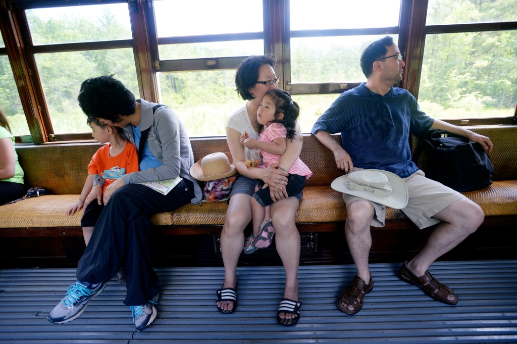 Left to right: Elliot Choi 4, Jane Sunoo, Saura Choi, Lydia Choi, 2, and Isaac Choi of New Jersey, enjoy a ride on a trolley at the Seashore Trolley Museum in Kennebunkport Wednesday, June 18, 2014.
