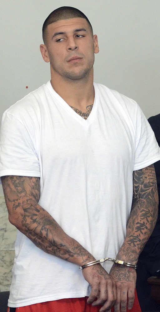 The Associated Press Former New England Patriots tight end Aaron Hernandez appears in shortsleeves at his arraignment in Attleboro District Court in Attleboro, Mass., in this June 26, 2013, photo.
