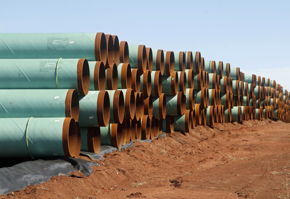 Miles of pipe ready to become part of the Keystone Pipeline are stacked in a field near Ripley, Okla. 2012 Associated Press file photo