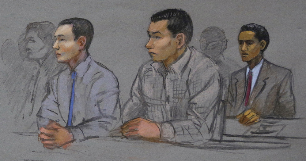 The Associated Press This courtroom sketch shows defendants Azamat Tazhayakov, left, Dias Kadyrbayev, center, and Robel Phillipos, right, college friends of Boston Marathon bombing suspect Dzhokhar Tsarnaev, during a hearing in federal court Tuesday in Boston.
