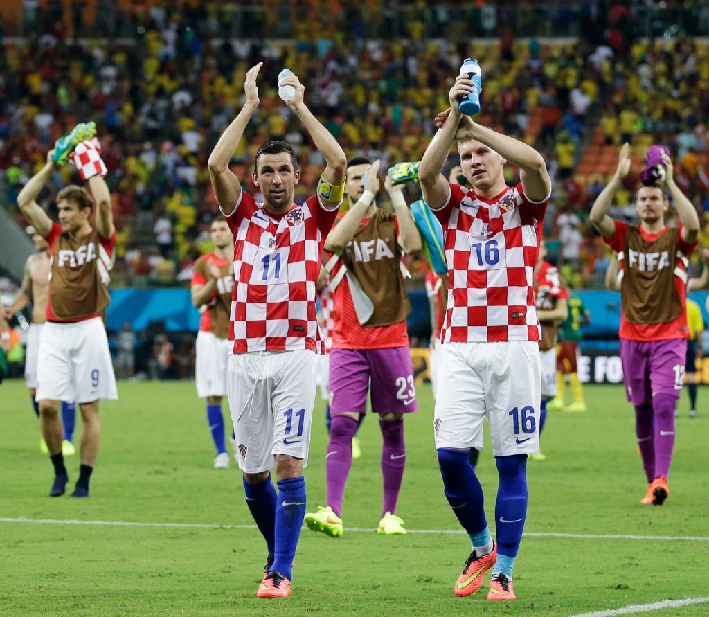 Croatian players applaud their supporters following their 4-0 victory over Cameroon during the group A World Cup soccer match at the Arena da Amazonia in Manaus, Brazil, Wednesday, June 18, 2014. 