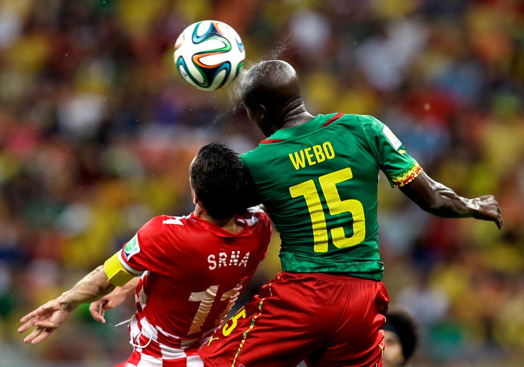 Cameroon's Pierre Webo, right, and Croatia's Darijo Srna battle for the ball during a group A World Cup soccer match Wednesday.