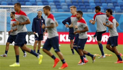 The United States soccer team warms up during an official training session Sunday, the day before the group G World Cup soccer match between Ghana and the United States at the Arena das Dunas in Natal, Brazil. The Associated Press