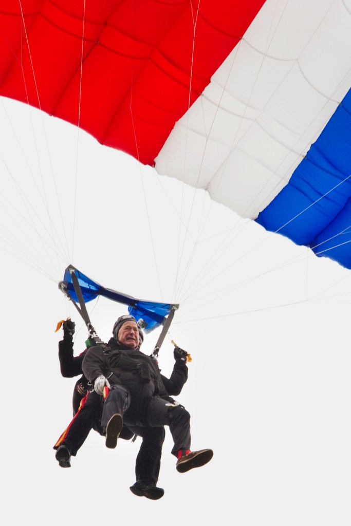 Former President George H. W. Bush celebrated his 90th birthday with a tandem skydive, landing on the lawn of St. Anne's church in Kennebunkport.
