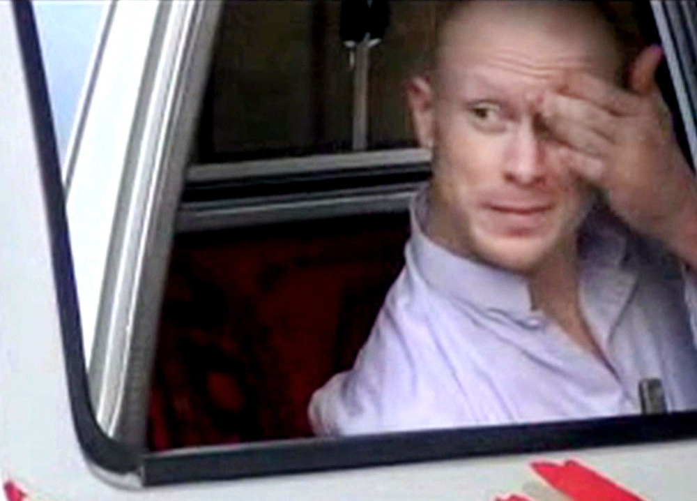 In this image taken from video, which has been authenticated based on its contents and other AP reporting, Sgt. Bowe Bergdahl sits in a vehicle guarded by the Taliban in eastern Afghanistan prior to his release Saturday. The Associated Press/Voice of Jihad website