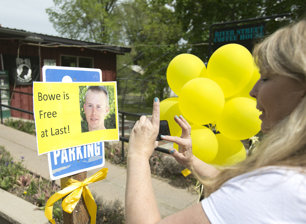 Diane Walker takes a picture of a sign celebrating U.S. Army Sgt. Bowe Bergdahlâs release in front of Zaneyâs coffee shop in Hailey, Idaho. Bergdahl, 28, had been held prisoner by the Taliban. The Associated Press