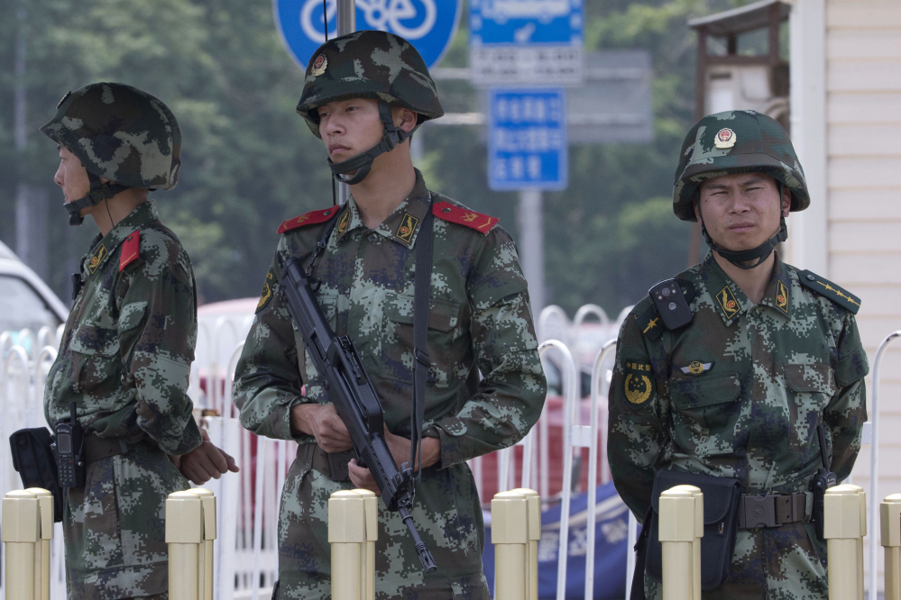 Chinese paramilitary police man a security checkpoint on Tiananmen Square in Beijing on Wednesday, the 25th anniversary of the brutal crackdown on student protesters. The Associated Press 